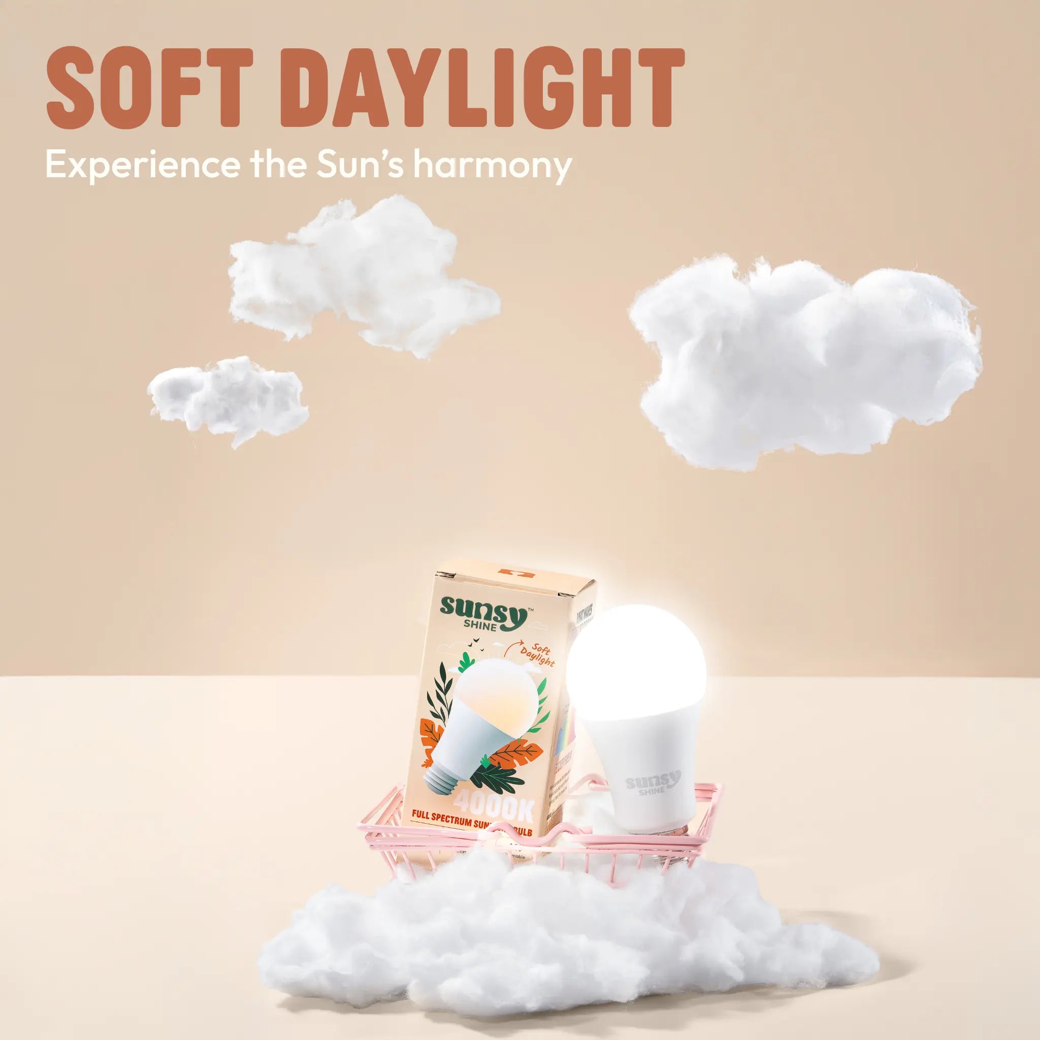 4000k light bulb and box sitting in a little pink cart surrounded by fluffy white clouds