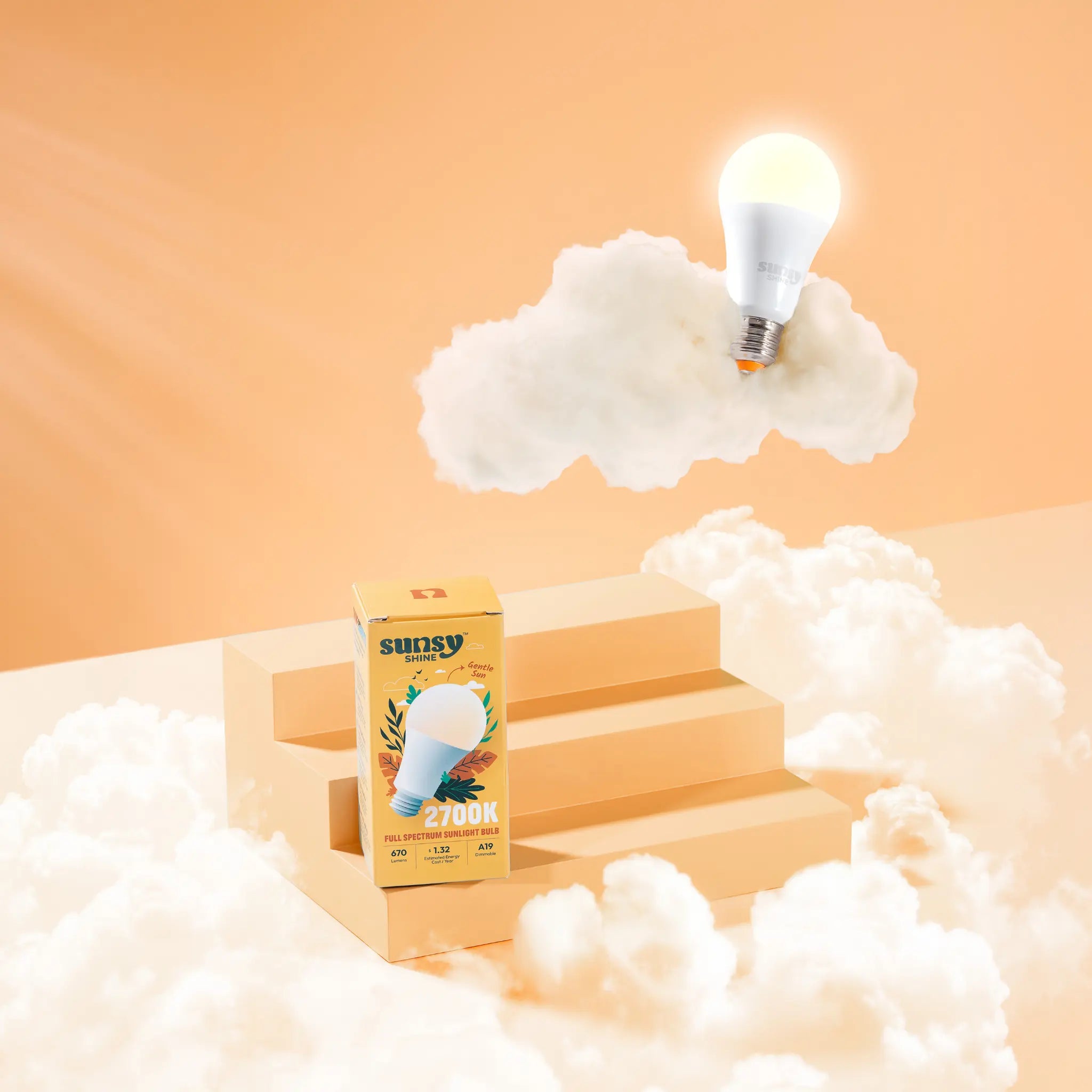 2700k light bulb box sitting on orange steps surrounded by clouds while the bulb is sitting on a cloud above it