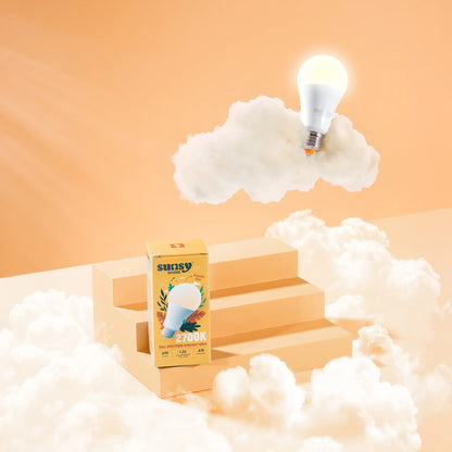 2700k light bulb box sitting on orange steps surrounded by clouds while the bulb is sitting on a cloud above it